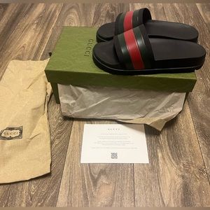Authentic Gucci slides size 7 and only worn twice. I have the box & receipt.